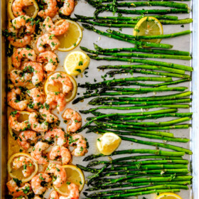 One Pan Roasted Lemon Butter Garlic Shrimp and Asparagus bursting with flavor and on your table in 15 MINUTES! No joke! The easiest, most satisfying meal that tastes totally gourmet!