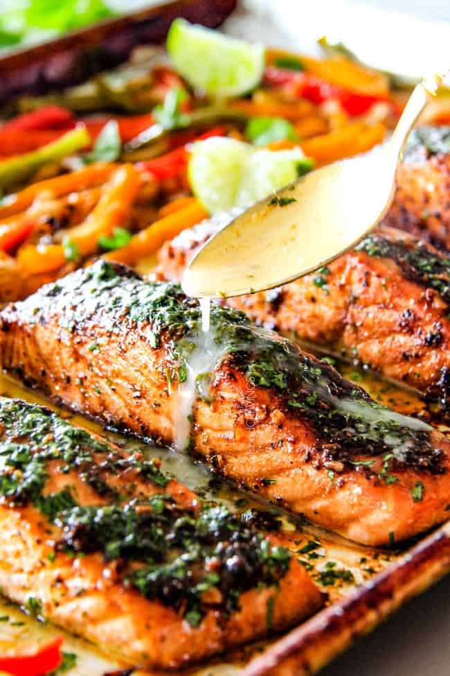Showing how to make Sheet Pan Fajita Salmon with Cilantro Lime Butter pouring butter over top.