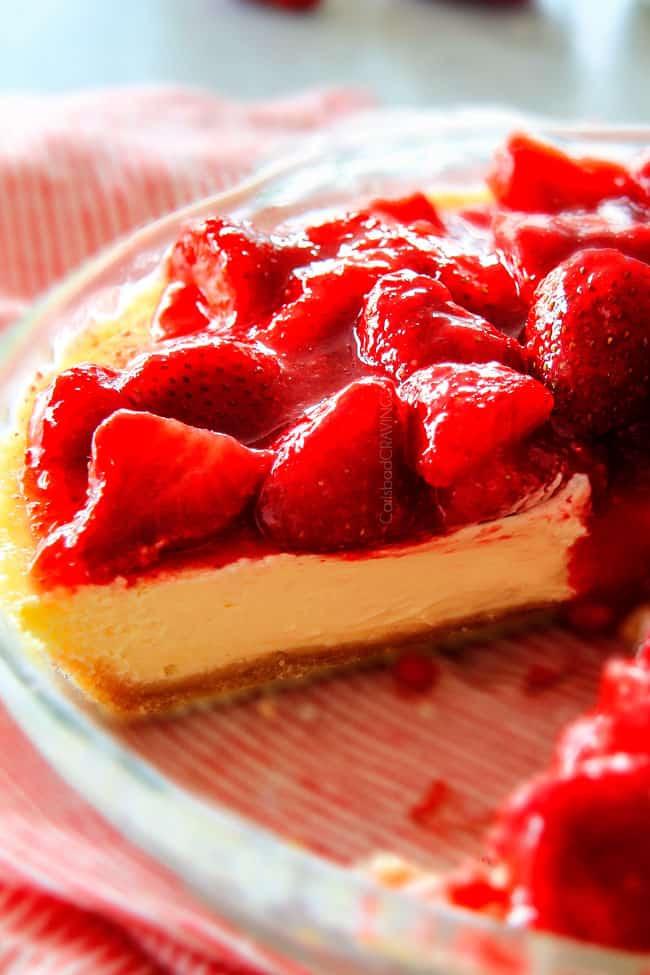 Strawberry Cheesecake with a slice missing.