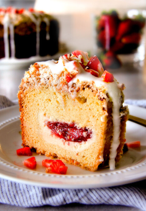 Strawberry Cream Cheese STUFFED Sour Cream Coffee Cake - this is the best strawberry coffee cake ever! the INCREDIBLY creamy cheesecake-like cream cheese filling and strawberries all topped with Coconut Pecan Streusel and Lemon Drizzle is OUT OF THIS WORLD! I can't say enough good things about this coffee cake!