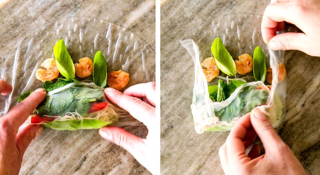 These insanely delicious Fresh Shrimp Spring Rolls are a flavor and texture explosion in every addictive bite and super easy to make with all my tips and tricks and step by step photos! and the the Pineapple Hoisin Peanut Sauce is EVERYTHING! showing how to make Vietnamese spring rolls by folding rice paper up over the bottom and the two sides in