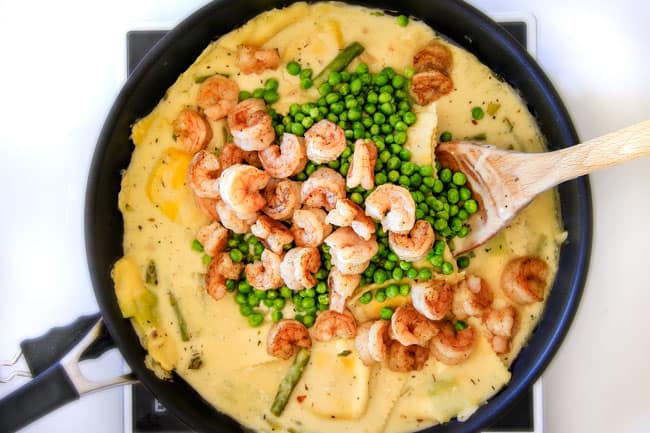 Showing how to make One Pot Lemon Garlic Cream Ravioli adding peas, Shrimp and Asparagus