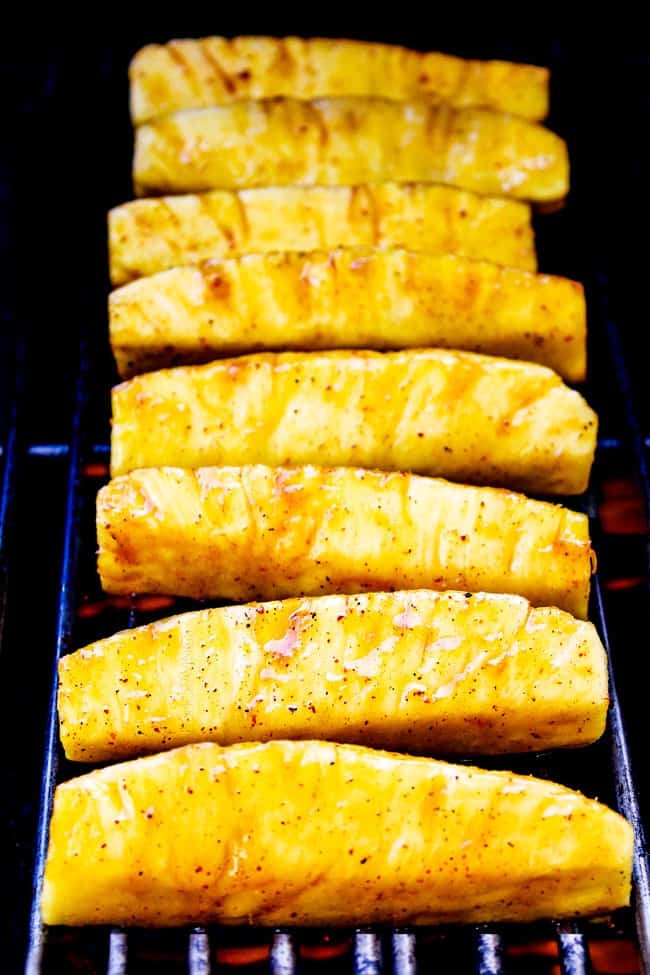 the BEST Caramelized Grilled Pineapple smothered with the moist irresistible buttery, sweet, tangy Brown Sugar Orange Glaze! You will never want to eat pineapple any other way again! Serve it as an easy appetizer, side or even dessert all summer long! showing how to make grilled pineapple by grilling on a grill