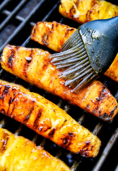 the BEST Caramelized Grilled Pineapple glazed with the moist irresistible buttery, tangy Brown Sugar Chili Glaze! You will never want to eat pineapple any other way again! Serve it as an easy appetizer, side or even dessert all summer long!