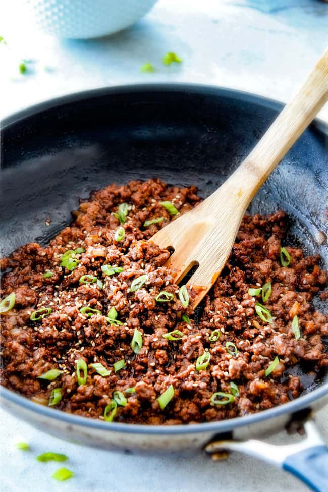showing how to make Korean Beef Bowls by browning ground beef in a skllet
