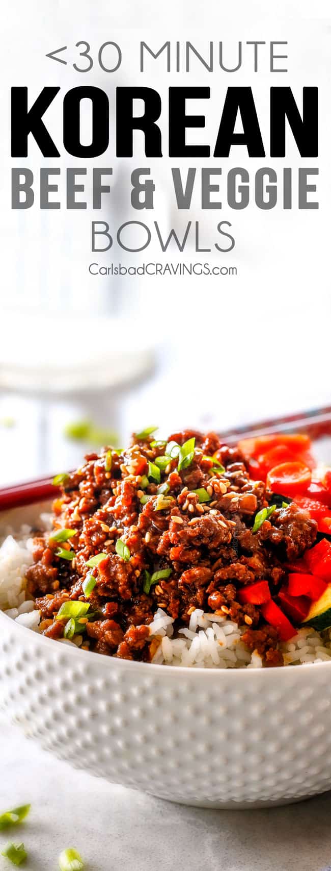 30 Minute Korean Beef Bowls are my absolute favorite last minute dinner! bursting with flavor and one of the absolute easiest meals you will ever make! Easy Korean Beef Bowls with ground beef, carrot and zucchini in a white bowl.
