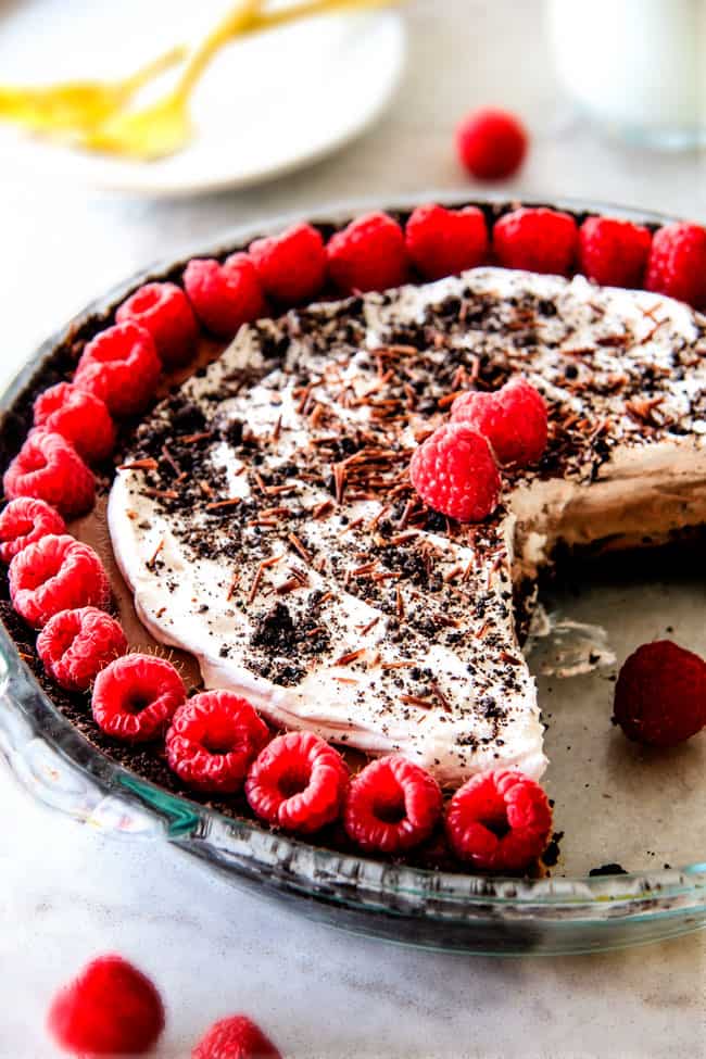 Wonderfully rich, crazy creamy, heavenly Mississippi Mud Pie with 4 EASY layers of decadence! Everyone will beg you for this TO LIVE FOR recipe! the best mississippi mud pie with a few slices taken out