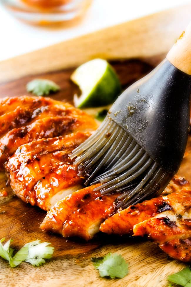 These are ADDICTINGLY DELICIOUS! ย Honey Chipotle Chicken Tacosย stuffed with wonderfully juicy, flavor packed Honey Chipotle Bacon Chicken (yes BACON chicken!), piled with crispy BLT Slaw and creamified with Cilantro Lime Crema! ย glazing chipotle chicken for honey chipotle chicken tacos