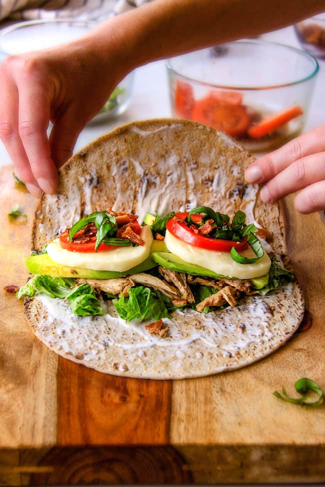 15 MINUTE Avocado Caprese Chicken Wraps ย - I am completely addicted to these wraps and they are totally easy and healthy! they are loaded with the most amazing balsamic chicken, juicy tomatoes, milky mozzarella, creamy avocadoes, crunchy romaine, fresh basil and crispy bacon all wrapped in a soft flatbread. ย seriously, to die for!ย