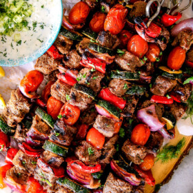 These easy Baked or Grilled Greek Beef Kabobs are so crazy juicy and exploding with flavor in every mouthwatering bite! ย And the creamy, refreshing Whipped Fetaย Whipped Feta Tzatziki Dip is out of this world! ย