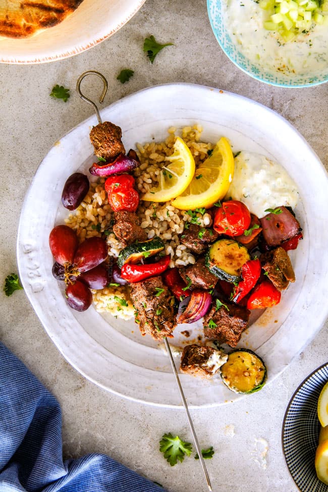These easy Baked or Grilled Greek Beef Kabobs are so crazy juicy and exploding with flavor in every mouthwatering bite! ย And the creamy, refreshing Whipped Fetaย Whipped Feta Tzatziki Dip is out of this world! ย