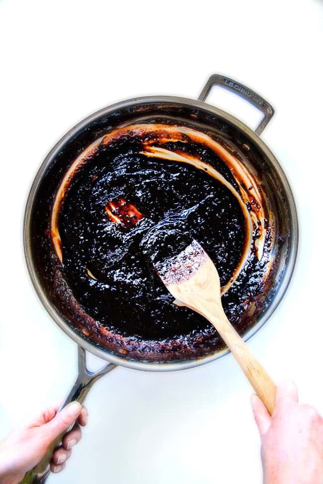 I am obsessed with this sweet and tangy, savory Slow Cooker Honey Balsamic Beef!!! ย It's fall apart tender, crazy juicy, packed with flavor and smothered in the most AMAZING honey balsamic sauce! ย perfect for sandwiches or stand alone delicious with rice and potatoes! showing how to make slow cooker roast beef by reducing sauce in a skillet