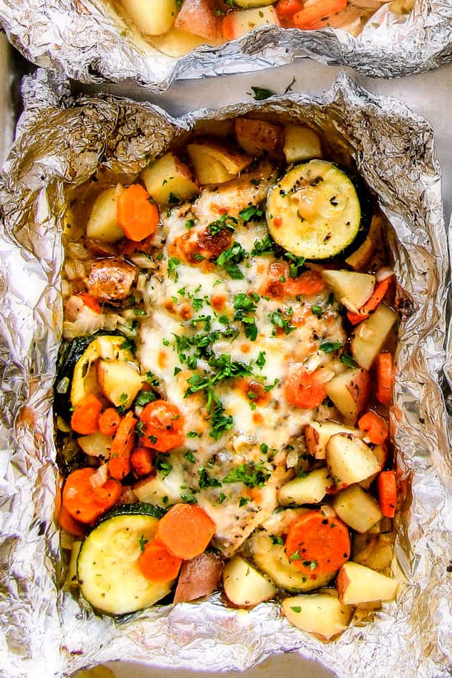 Baked or Grilledย Italian Mozzarella Chicken Foil Packets are bursting with astonishingly juicy, flavorful chicken and tender, seasoned Potatoes, Carrots and Zucchini all smothered with Mozzarella Cheese! ย These foil packets are meal-in-one that are quick to throw together and even quicker to clean up!ย