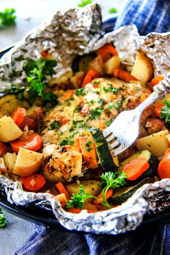 Baked or Grilledย Italian Mozzarella Chicken Foil Packets are bursting with astonishingly juicy, flavorful chicken and tender, seasoned Potatoes, Carrots and Zucchini all smothered with Mozzarella Cheese! ย These foil packets are meal-in-one that are quick to throw together and even quicker to clean up!ย