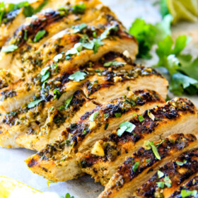 Easy, juicy, flavorful Cilantro Lime Chicken seeping with flavor is a meal in itself orย instantly transforms salads, tacos, burritos, wraps, etc into the most epic meal EVER! I love having this chicken on hand!