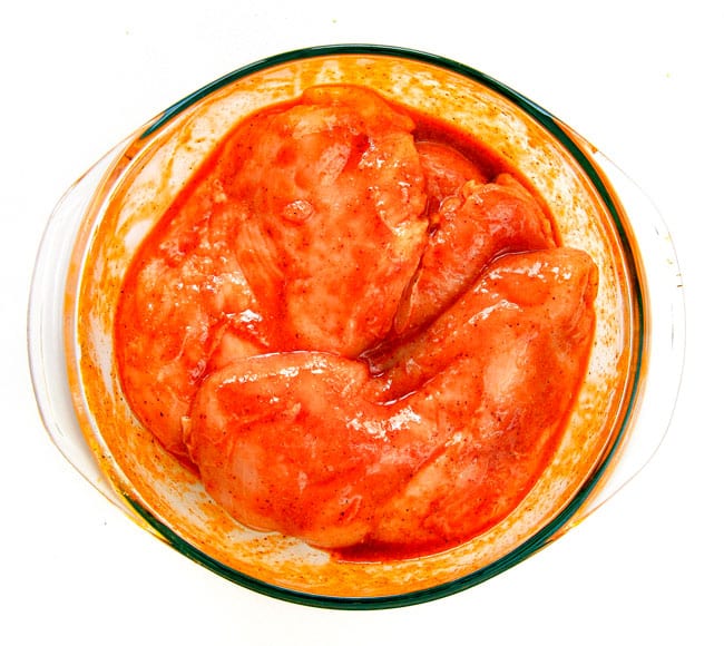 EASY Baked or Grilled Cheesy Buffalo Chicken Foil Packets bursting with juicy chicken and tender, flavorful veggies all smothered in cheddar and dipped in Ranch Crema! ย these are SO addictingly delicious!!! ย ย