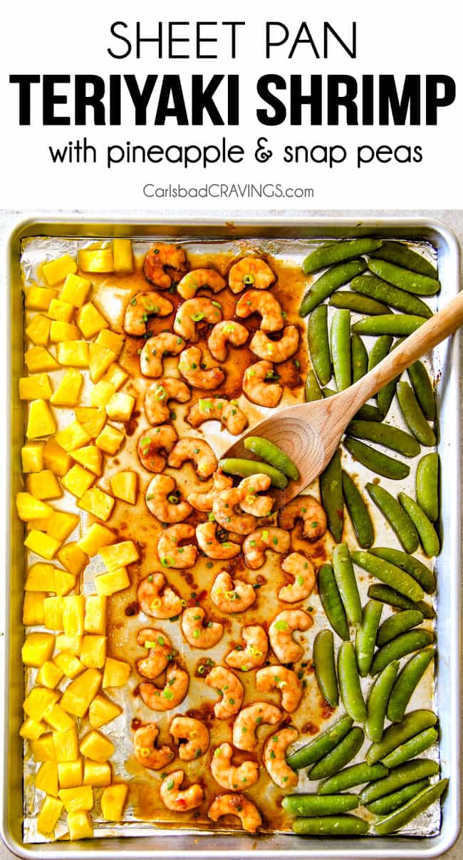 top view of teriyaki shrimp on a sheet pan with pineapple and snow peas. 