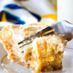 This Banana Coconut Cream Pie is absolutely AMAZING!  Its the best ever banana pie and coconut cream pie mashed together nestled in an easy, Vanilla Wafer Coconut Crust and topped with COCONUT whipped cream!  #thanksgiving #easter