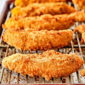 incredibly tender, juicy flavorful Baked Cheddar Ranch Chicken Tenders coated in the most AMAZING cheese cracker breading!ย These are pure addicting and SO EASY!ย