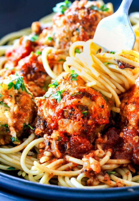 Easy, juicy, flavorful Italian meatballs bathed in rich marinara, smothered in mozzarella and Parmesan and baked to golden cheesy deliciousness!  This is one of my favorite recipes EVER and they make the BEST spaghetti and meatballs!