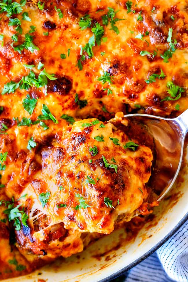 Easy, juicy, flavorful Italian meatballs bathed in rich marinara, smothered in mozzarella and Parmesan and baked to golden cheesy deliciousness!ย This is one of my favorite recipes EVER and they make the BESTย spaghetti and meatballs!