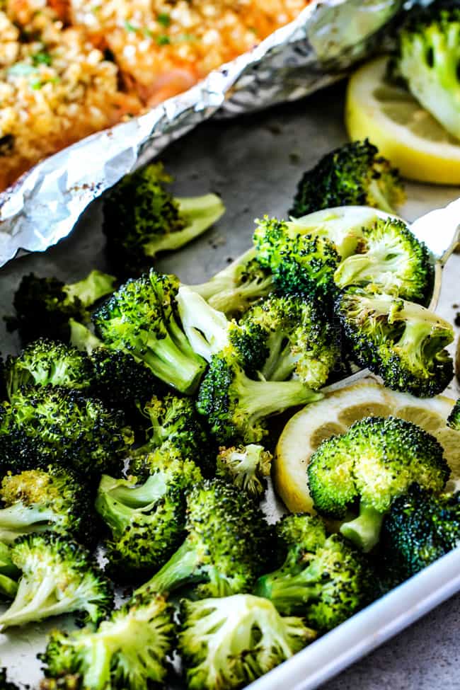 25 MINUTE Baked Lemon Garlic Butter Salmon with Crispy Parmesan Panko & Broccoli!ย This salmon is not only bursting with flavor and sooo juicy and tender but the easiest, most satisfying meal that tastes totally gourmet!ย My parents were blown away by this meal! up close of broccoli showing what to serve with oven baked salmon