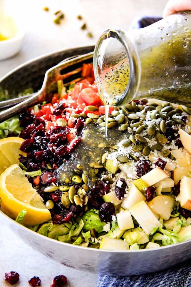 Cranberry Apple Shaved Brussels Sprouts Salad with Lemon Poppy Seed Dressing is one of my favorite salads IN THE WORLD! It belongs on your table this Thanksgiving and Christmas and all season long! The perfect STRESS FREE make ahead side that is flavor and texture heaven! #thanksgivingside #thanksgivingsalad