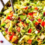 Cranberry Apple Shaved Brussels Sprouts Salad with Lemon Poppy Seed Dressing is one of my favorite salads IN THE WORLD! It belongs on your table this Thanksgiving and Christmas and all season long!  The perfect STRESS FREE make ahead side that is flavor and texture heaven!  #thanksgivingside #thanksgivingsalad