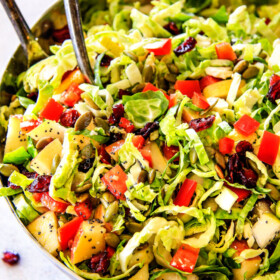 Cranberry Apple Shaved Brussels Sprouts Salad with Lemon Poppy Seed Dressing is one of my favorite salads IN THE WORLD! It belongs on your table this Thanksgiving and Christmas and all season long!ย The perfect STRESS FREE make ahead side that is flavor and texture heaven!ย #thanksgivingside #thanksgivingsalad
