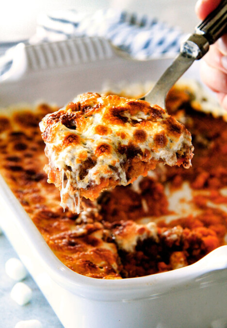 The best ever  Sweet Potato Casserole with Marshmallows AND buttery, brown sugar Pecan Topping!  This Sweet Potato Casserole has been our favorite recipe ever since we tasted it almost a decade ago and you will love that you can assemble it the night before Thanksgiving or Christmas!  No Thanksgiving table is complete without this comforting classic!