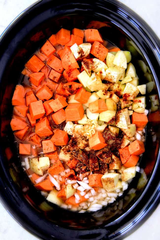 this SUPER creamy Slow Cooker Chipotle Sweet Potato Soup is AMAZING!ย Its loaded with flavor, gluten free, dairy free, crazy healthy and so easy!ย Definitely one of my new favorite soups!ย ย showing how to make Sweet Potato Soup by adding sweet potatoes, onions, garlic and apples to pot