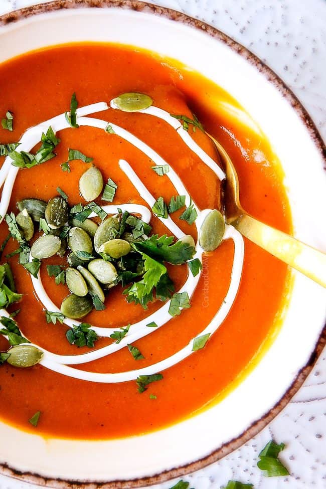 this SUPER creamy Slow Cooker Chipotle Sweet Potato Soup is AMAZING! Its loaded with flavor, vegan, crazy healthy and so easy! Definitely one of my new favorite soups!