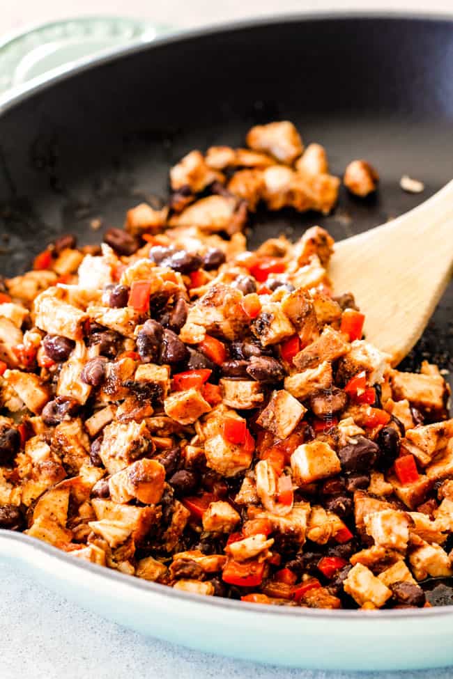 Showing how to make Chipotle Chicken Empanadas by cooking ingredients.