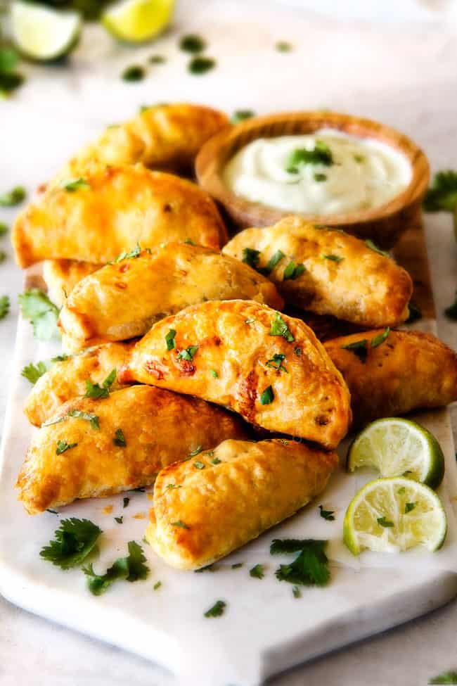 Chipotle Chicken Empanadas with Avocado Dip with lime.