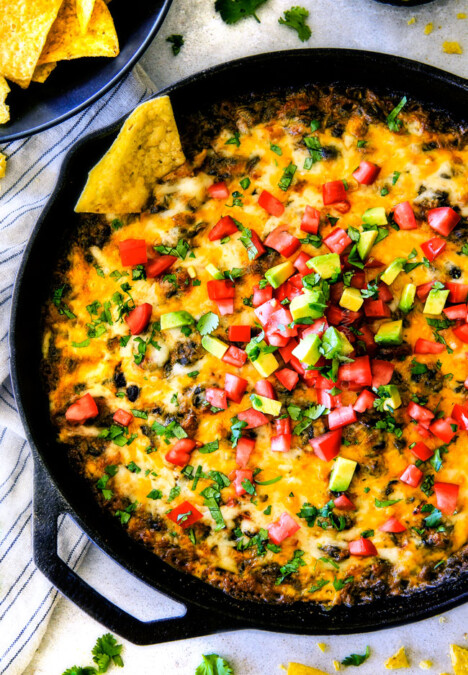 This warm, creamy, cheesy Mexican Spinach Dip is easy, make ahead, bursting with fiestalicious spices and quite possibly the BEST Spinach Dip ever AKA your new back pocket crowd pleasing appetizer for every occasion!