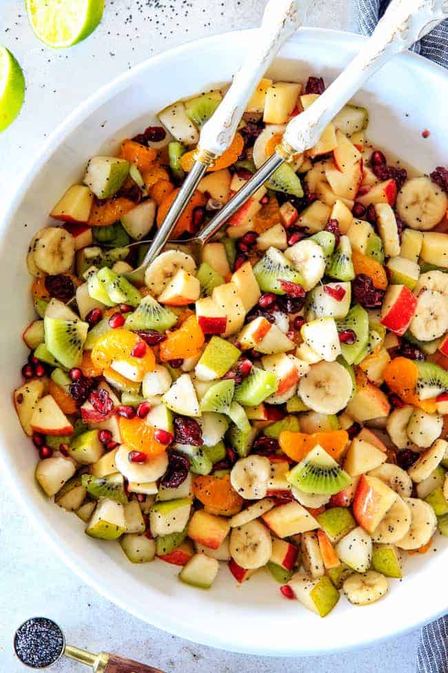 Irresistibly delicious, fresh and vibrant Winter Fruit Salad with Honey Lime Poppy Seed Vinaigrette is simple to whip together but canโt stop eating delicious! It makes the perfect Thanksgiving or Christmas side!