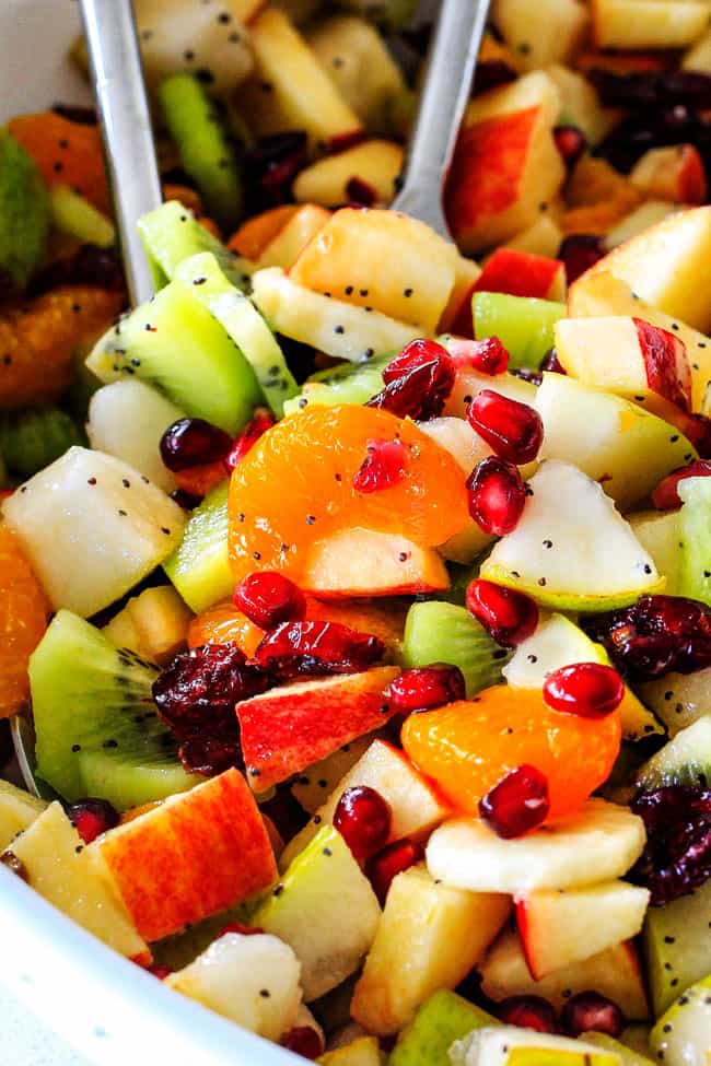 Irresistibly delicious, fresh and vibrant Winter Fruit Salad with Honey Lime Poppy Seed Vinaigrette is simple to whip together but canโt stop eating delicious! It makes the perfect Thanksgiving or Christmas side!