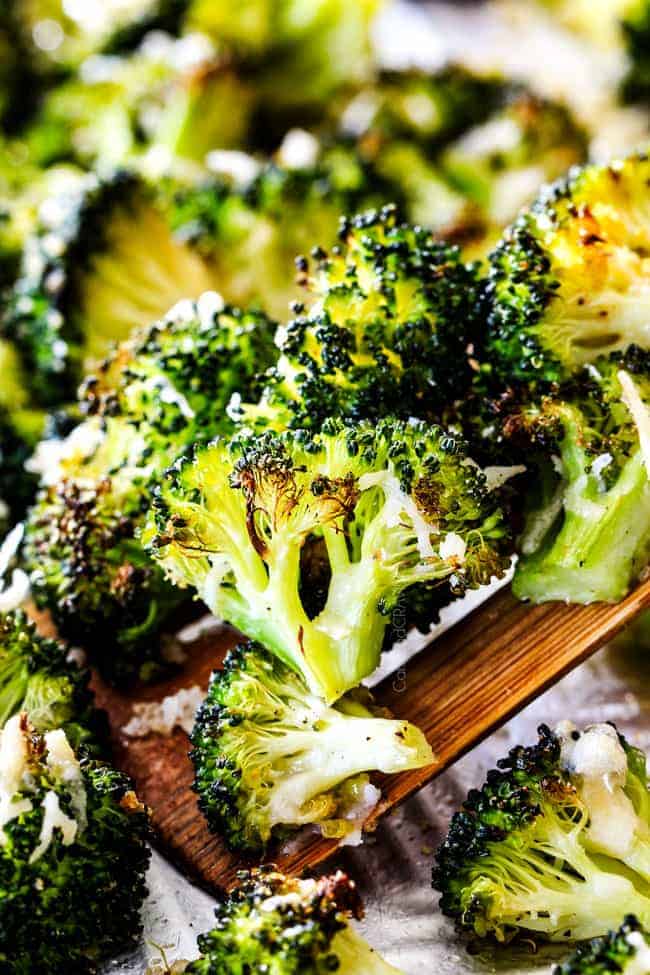 QUICK AND EASY this Parmesan Roasted Broccoli is bursting with flavor, caramelized crispy tops and the quickest side dish to everyย meal all made in ONE PAN!ย AKA Minimal effort, HUGE flavor! roasted broccoli with parmesan cooked in the oven on a baking sheet