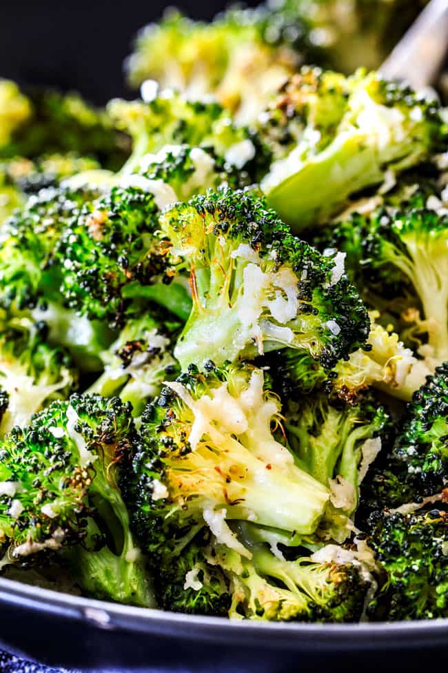 QUICK AND EASY this Parmesan Roasted Broccoli is bursting with flavor, caramelized crispy tops and the quickest side dish to everyย meal all made in ONE PAN!ย AKA Minimal effort, HUGE flavor! a bowl of roasted broccoli with parmesan