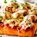 These Cheesy Italian Meatball Sliders are my favorite party food ever and my family loves them for dinner!  The meatballs are the BEST (so tender and juicy!) and the marinara is amazing and I love how they are individual sliders instead of meatball subs!  I can't recommend these enough! 