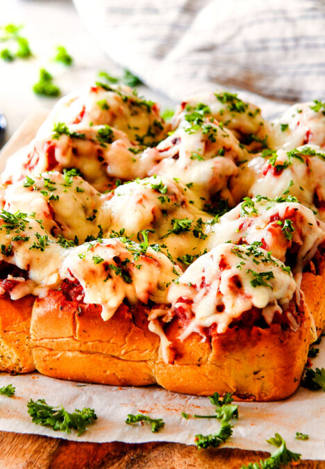 These Cheesy Italian Meatball Sliders are my favorite party food ever and my family loves them for dinner!  The meatballs are the BEST (so tender and juicy!) and the marinara is amazing and I love how they are individual sliders instead of meatball subs!  I can't recommend these enough! 