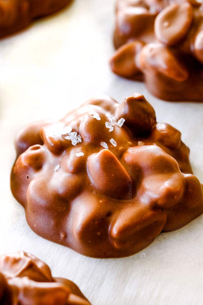 FOOL PROOF Crockpot Chocolate Peanut Clusters are not only crazy delicious but are SO easy!ย They make the best make ahead, stress free gifts!ย This post also includes tips and tricks to make them successful every time!