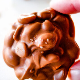 FOOL PROOF Crockpot Chocolate Peanut Clusters are not only crazy delicious but are SO easy!ย They make the best make ahead, stress free gifts!ย This post also includes tips and tricks to make them successful every time!