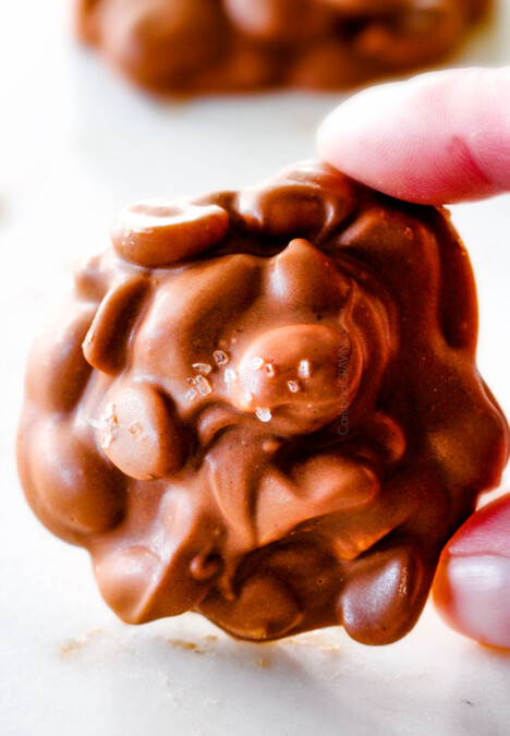 FOOL PROOF Crockpot Chocolate Peanut Clusters are not only crazy delicious but are SO easy!  They make the best make ahead, stress free gifts!  This post also includes tips and tricks to make them successful every time!
