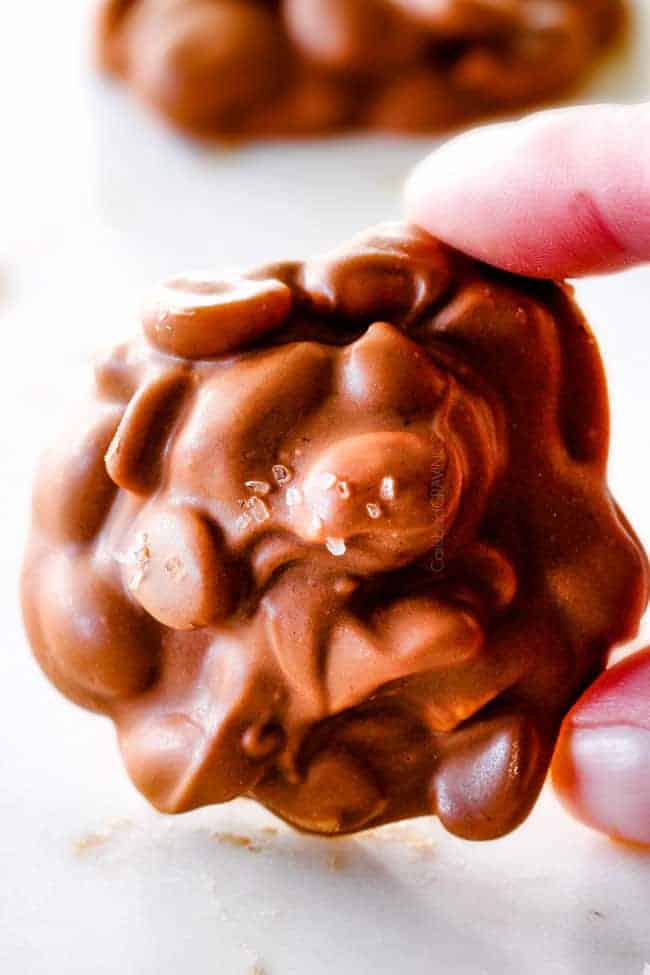 FOOL PROOF Crockpot Chocolate Peanut Clusters are not only crazy delicious but are SO easy!ย They make the best make ahead, stress free gifts!ย This post also includes tips and tricks to make them successful every time!