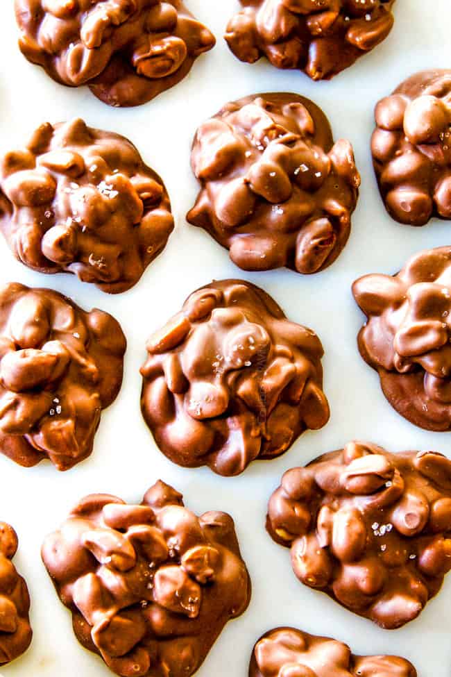 FOOL PROOF Crockpot Chocolate Peanut Clusters are not only crazy delicious but are SO easy!ย They make the best make ahead, stress free gifts!ย This post also includes tips and tricks to make them successful every time!