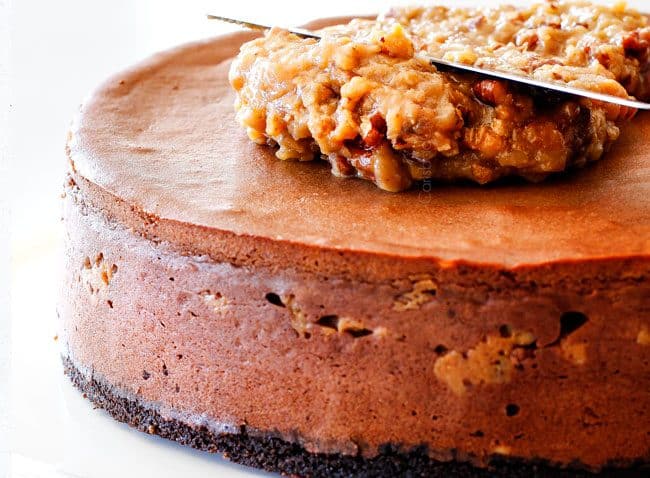 German Chocolate Cheesecake adding the icing on top.