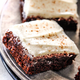 Soft and chewy Gingerbread Brownies are your favorite holiday cookie in rich chocolate brownie form all smothered in luscious Eggnog Cream Cheese Frosting!ย These are destined to become a must make holiday favorite and so much easier than rolling/baking individual cookies!ย