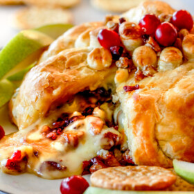 Rich and creamy Baked Brie in Puff Pastry is always a total luxuriously tasting crowd pleaser with minimal effort!ย (step by step pictures included)ย It can be prepped in advance then baked when you're ready for company!ย