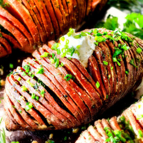 These Hasselback Sweet Potatoes are tender, melt-in-your-mouth and bursting with garlic herb, butter flavor!ย They look wonderfully gourmet for holidays and special occasions but are everyday easy!ย
